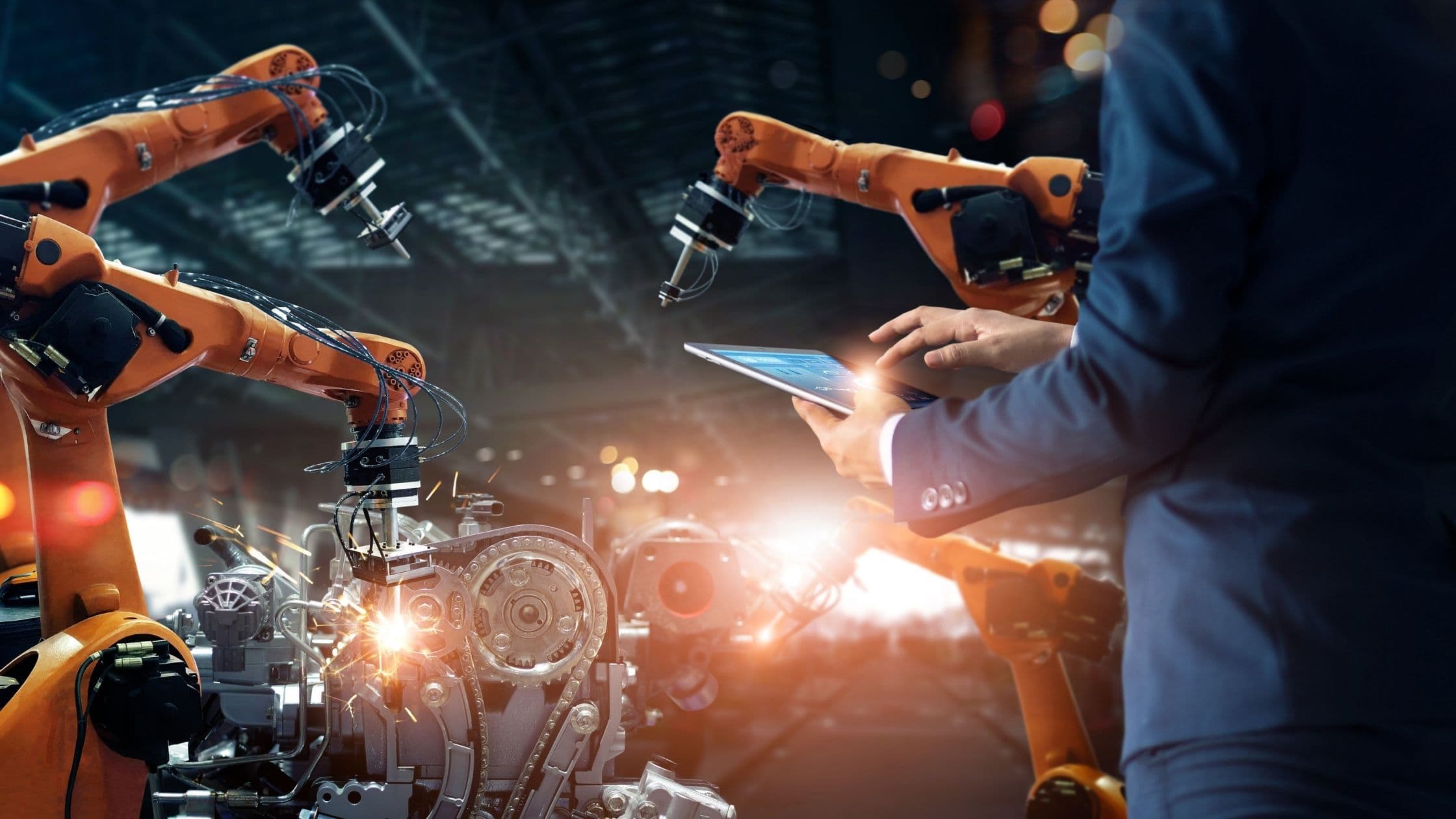 an engineer performing robotic welding