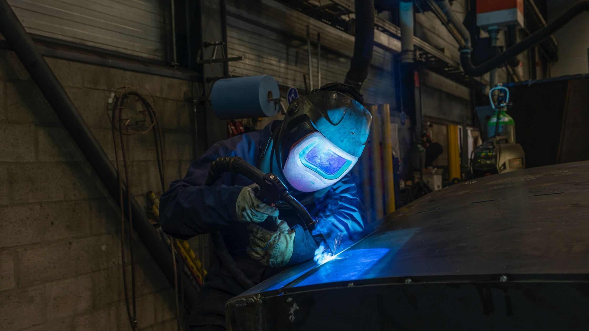 What is Custom Metal Fabrication? Person TIG Welding a custam metal fabrication