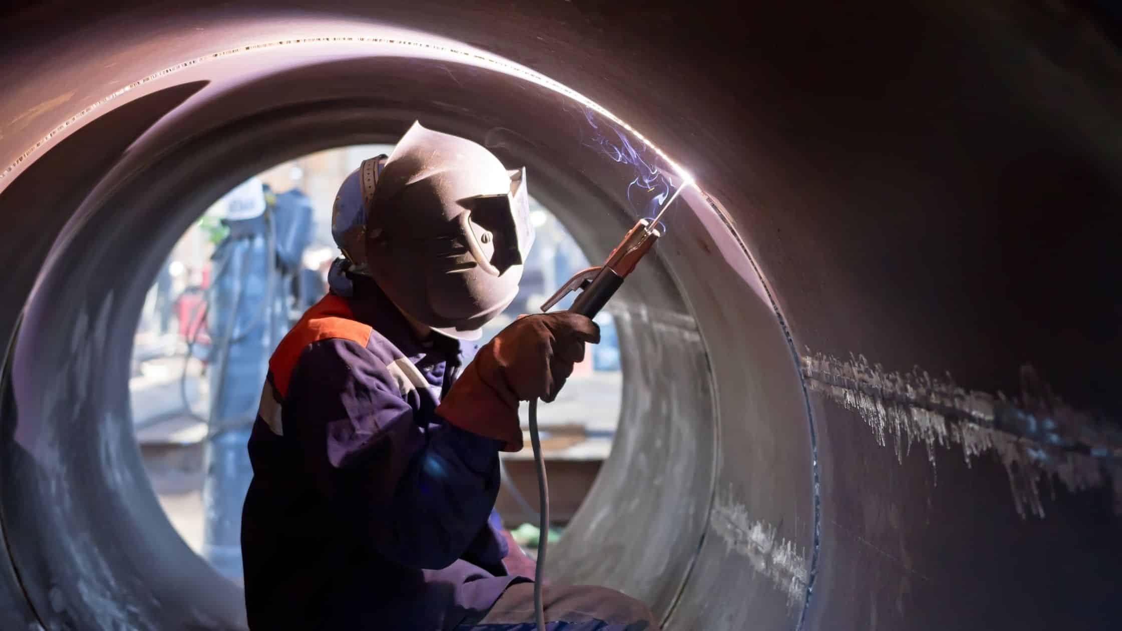 How to Pipe to Pipe Welding? a worker welding from pipe to pipe welding